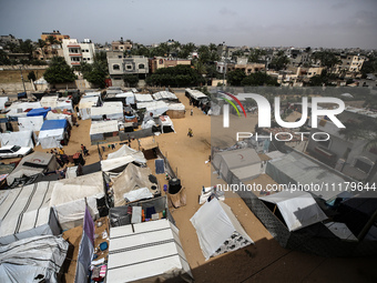 Palestinians are taking shelter in a tent camp in Deir Balah in the central Gaza Strip on April 26, 2024, as they flee their homes due to Is...