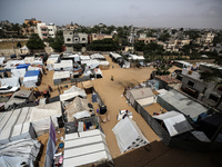 Palestinians are taking shelter in a tent camp in Deir Balah in the central Gaza Strip on April 26, 2024, as they flee their homes due to Is...