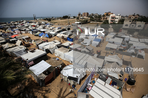 Palestinians are taking shelter in a tent camp in Deir Balah in the central Gaza Strip on April 26, 2024, as they flee their homes due to Is...