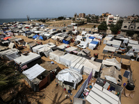 Palestinians are taking shelter in a tent camp in Deir Balah in the central Gaza Strip on April 26, 2024, as they flee their homes due to Is...