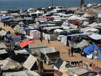 Palestinians are taking shelter in a tent camp in Deir Balah in the central Gaza Strip on April 26, 2024, as they flee their homes due to Is...