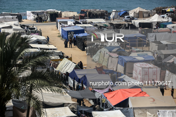 Palestinians are taking shelter in a tent camp in Deir Balah in the central Gaza Strip on April 26, 2024, as they flee their homes due to Is...