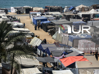 Palestinians are taking shelter in a tent camp in Deir Balah in the central Gaza Strip on April 26, 2024, as they flee their homes due to Is...