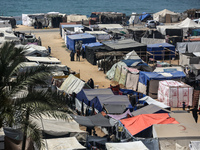 Palestinians are taking shelter in a tent camp in Deir Balah in the central Gaza Strip on April 26, 2024, as they flee their homes due to Is...