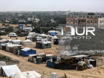 Palestinians are taking shelter in a tent camp in Deir Balah in the central Gaza Strip on April 26, 2024, as they flee their homes due to Is...