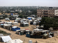 Palestinians are taking shelter in a tent camp in Deir Balah in the central Gaza Strip on April 26, 2024, as they flee their homes due to Is...