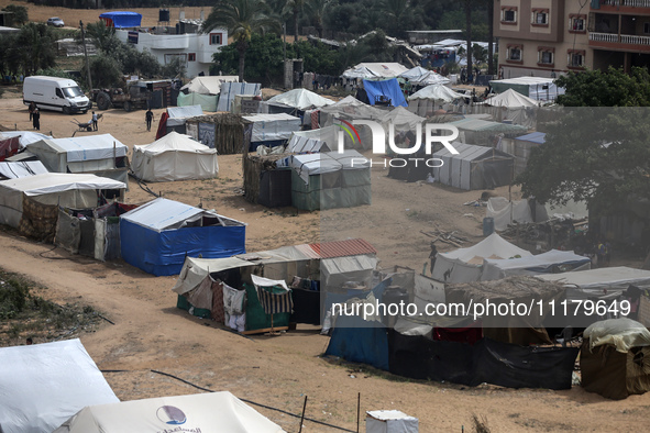 Palestinians are taking shelter in a tent camp in Deir Balah in the central Gaza Strip on April 26, 2024, as they flee their homes due to Is...