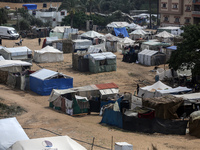 Palestinians are taking shelter in a tent camp in Deir Balah in the central Gaza Strip on April 26, 2024, as they flee their homes due to Is...