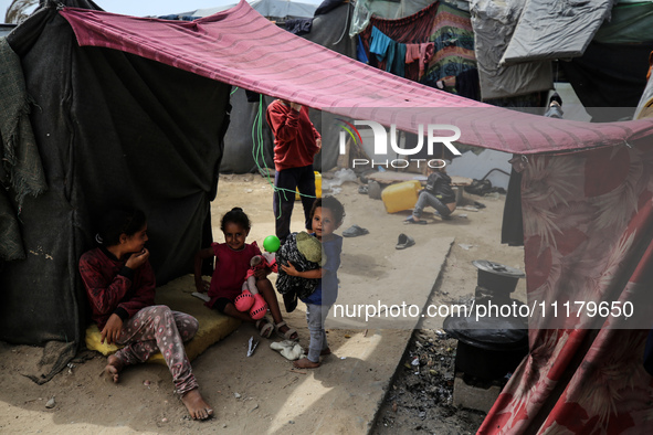 Palestinians are taking shelter in a tent camp in Deir Balah in the central Gaza Strip on April 26, 2024, as they flee their homes due to Is...