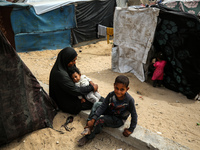 Palestinians are taking shelter in a tent camp in Deir Balah in the central Gaza Strip on April 26, 2024, as they flee their homes due to Is...