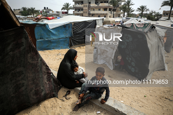 Palestinians are taking shelter in a tent camp in Deir Balah in the central Gaza Strip on April 26, 2024, as they flee their homes due to Is...