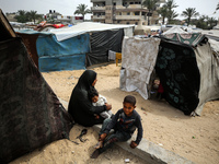 Palestinians are taking shelter in a tent camp in Deir Balah in the central Gaza Strip on April 26, 2024, as they flee their homes due to Is...