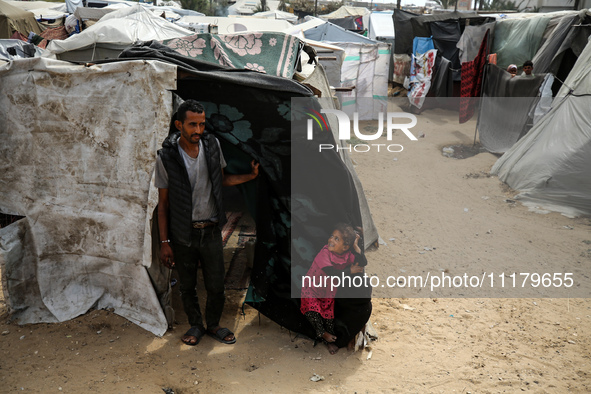 Palestinians are taking shelter in a tent camp in Deir Balah in the central Gaza Strip on April 26, 2024, as they flee their homes due to Is...