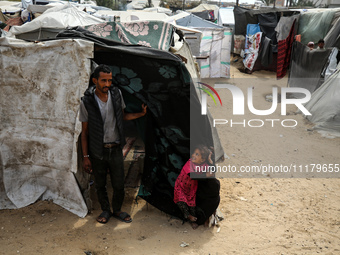 Palestinians are taking shelter in a tent camp in Deir Balah in the central Gaza Strip on April 26, 2024, as they flee their homes due to Is...