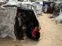 Palestinians are taking shelter in a tent camp in Deir Balah in the central Gaza Strip on April 26, 2024, as they flee their homes due to Is...