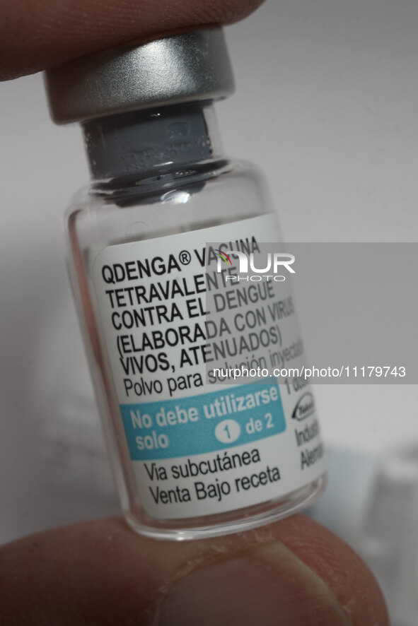 A vial of the German-made Qdenga vaccine is being displayed. Discussions are intensifying over dengue vaccination due to the lack of an offi...