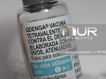 A vial of the German-made Qdenga vaccine is being displayed. Discussions are intensifying over dengue vaccination due to the lack of an offi...