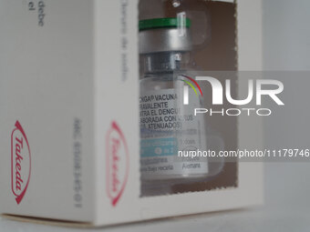 A vial of the German-made Qdenga vaccine is being displayed. Discussions are intensifying over dengue vaccination due to the lack of an offi...