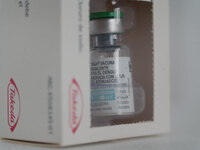 A vial of the German-made Qdenga vaccine is being displayed. Discussions are intensifying over dengue vaccination due to the lack of an offi...