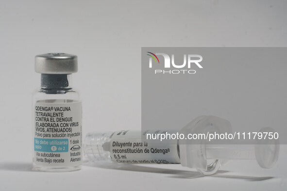 A vial of the German-made Qdenga vaccine is being displayed. Discussions are intensifying over dengue vaccination due to the lack of an offi...