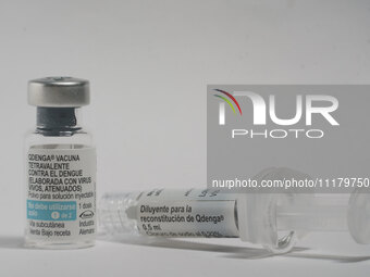 A vial of the German-made Qdenga vaccine is being displayed. Discussions are intensifying over dengue vaccination due to the lack of an offi...