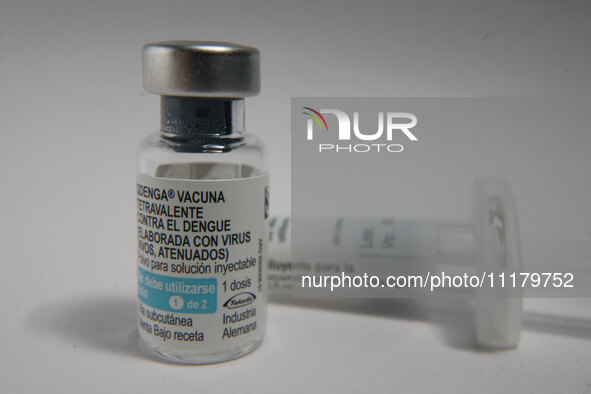 A vial of the German-made Qdenga vaccine is being displayed. Discussions are intensifying over dengue vaccination due to the lack of an offi...