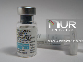 A vial of the German-made Qdenga vaccine is being displayed. Discussions are intensifying over dengue vaccination due to the lack of an offi...