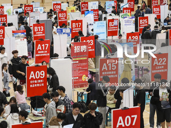 College students are choosing positions at a campus job fair in Huai'an, China, on April 27, 2024. (