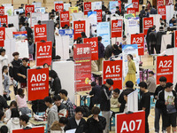 College students are choosing positions at a campus job fair in Huai'an, China, on April 27, 2024. (