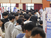 College students are choosing positions at a campus job fair in Huai'an, China, on April 27, 2024. (