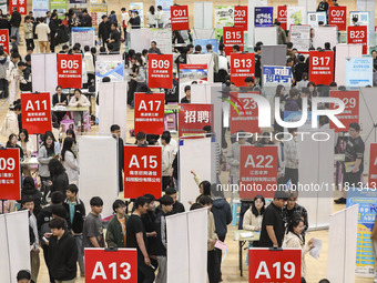 College students are choosing positions at a campus job fair in Huai'an, China, on April 27, 2024. (