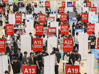 College students are choosing positions at a campus job fair in Huai'an, China, on April 27, 2024. (