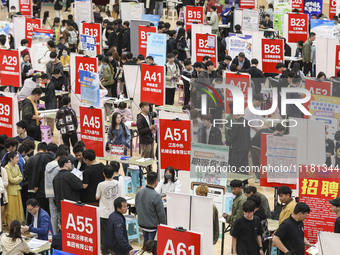 College students are choosing positions at a campus job fair in Huai'an, China, on April 27, 2024. (