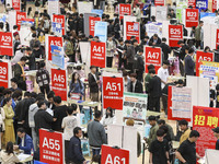 College students are choosing positions at a campus job fair in Huai'an, China, on April 27, 2024. (