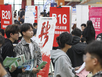 College students are choosing positions at a campus job fair in Huai'an, China, on April 27, 2024. (