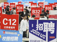 College students are choosing positions at a campus job fair in Huai'an, China, on April 27, 2024. (