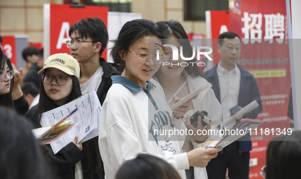 College students are choosing positions at a campus job fair in Huai'an, China, on April 27, 2024. 