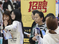 College students are choosing positions at a campus job fair in Huai'an, China, on April 27, 2024. (