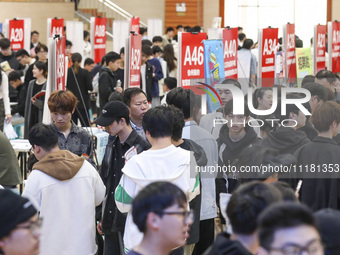 College students are choosing positions at a campus job fair in Huai'an, China, on April 27, 2024. (