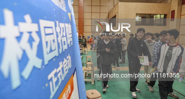 College students are choosing positions at a campus job fair in Huai'an, China, on April 27, 2024. 