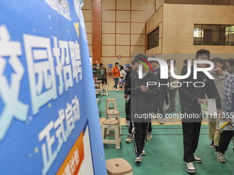 College students are choosing positions at a campus job fair in Huai'an, China, on April 27, 2024. (