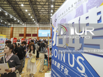 College students are choosing positions at a campus job fair in Huai'an, China, on April 27, 2024. (