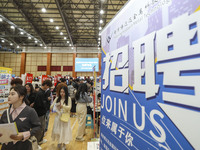 College students are choosing positions at a campus job fair in Huai'an, China, on April 27, 2024. (