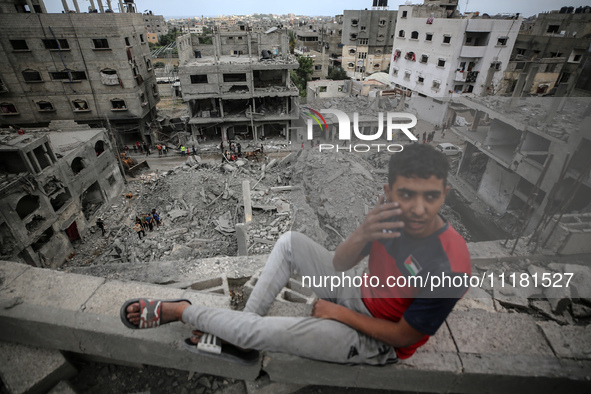 Palestinians are checking the damage in a house that was destroyed by an overnight Israeli bombardment in Nuseirat camp in the central Gaza...