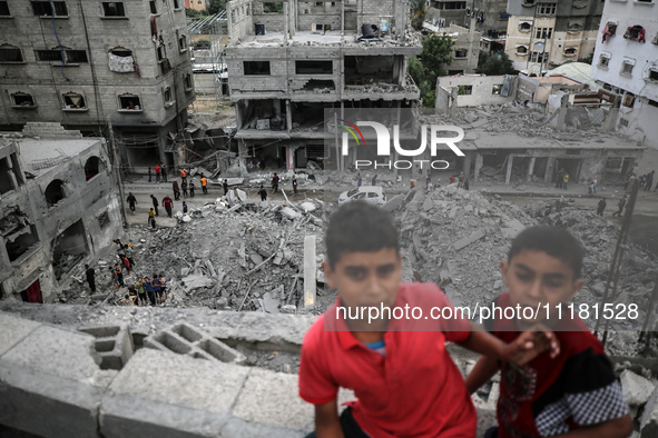 Palestinians are checking the damage in a house that was destroyed by an overnight Israeli bombardment in Nuseirat camp in the central Gaza...