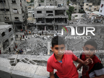 Palestinians are checking the damage in a house that was destroyed by an overnight Israeli bombardment in Nuseirat camp in the central Gaza...