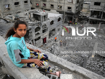 Palestinians are checking the damage in a house that was destroyed by an overnight Israeli bombardment in Nuseirat camp in the central Gaza...