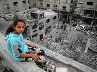 Palestinians are checking the damage in a house that was destroyed by an overnight Israeli bombardment in Nuseirat camp in the central Gaza...