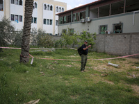 Simon Elmont from Humanity and Inclusion UK is examining and tagging large Israeli unexploded weapons to try to ensure maximum safety in Dei...