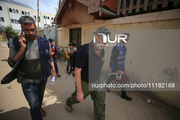 Simon Elmont from Humanity and Inclusion UK is examining and tagging large Israeli unexploded weapons to try to ensure maximum safety in Dei...